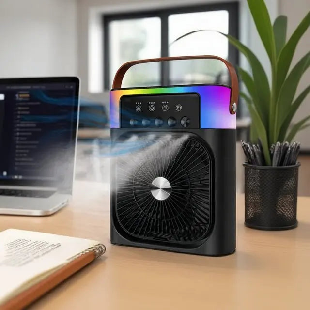 Portable Rechargeable Spray Fan with colorful LED lights on a desk next to a laptop and plant