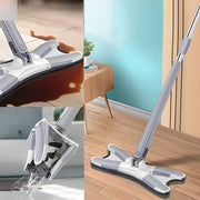 The mop is placed in a wooden floor and clean up a large spill. The mop head is being wrung out under running water.