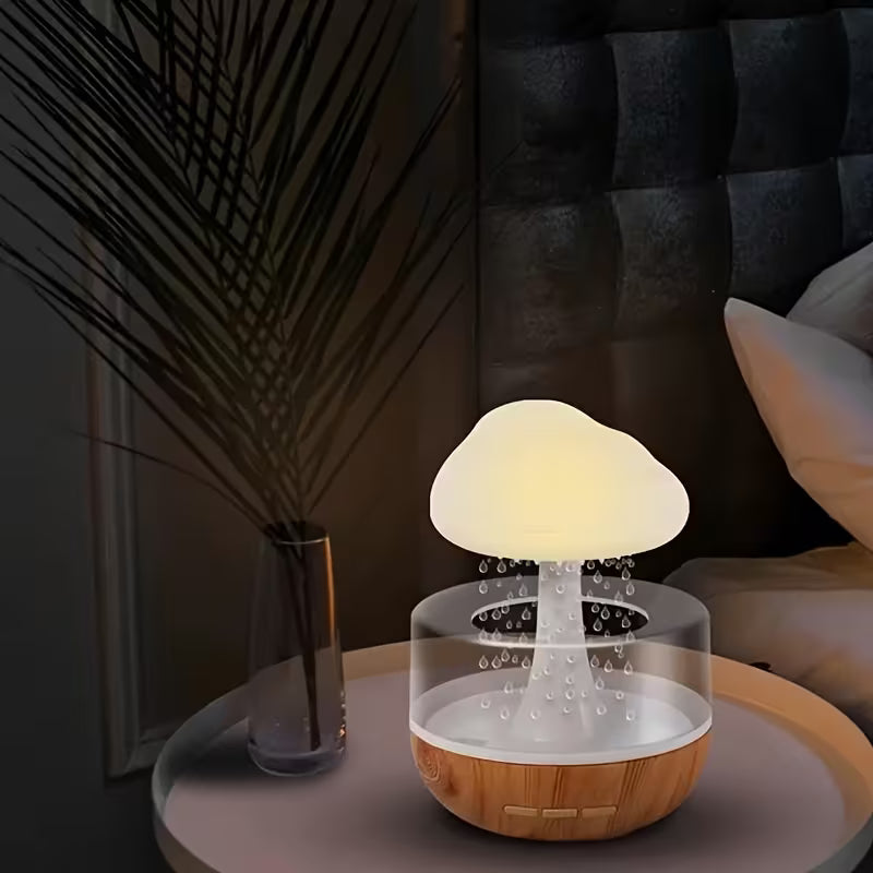 Cloud Rain Humidifier on a nightstand with a dark room background