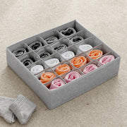 20 Grid Foldable Drawer Organizer Storage Box with neatly folded socks in various colors on a beige carpet.