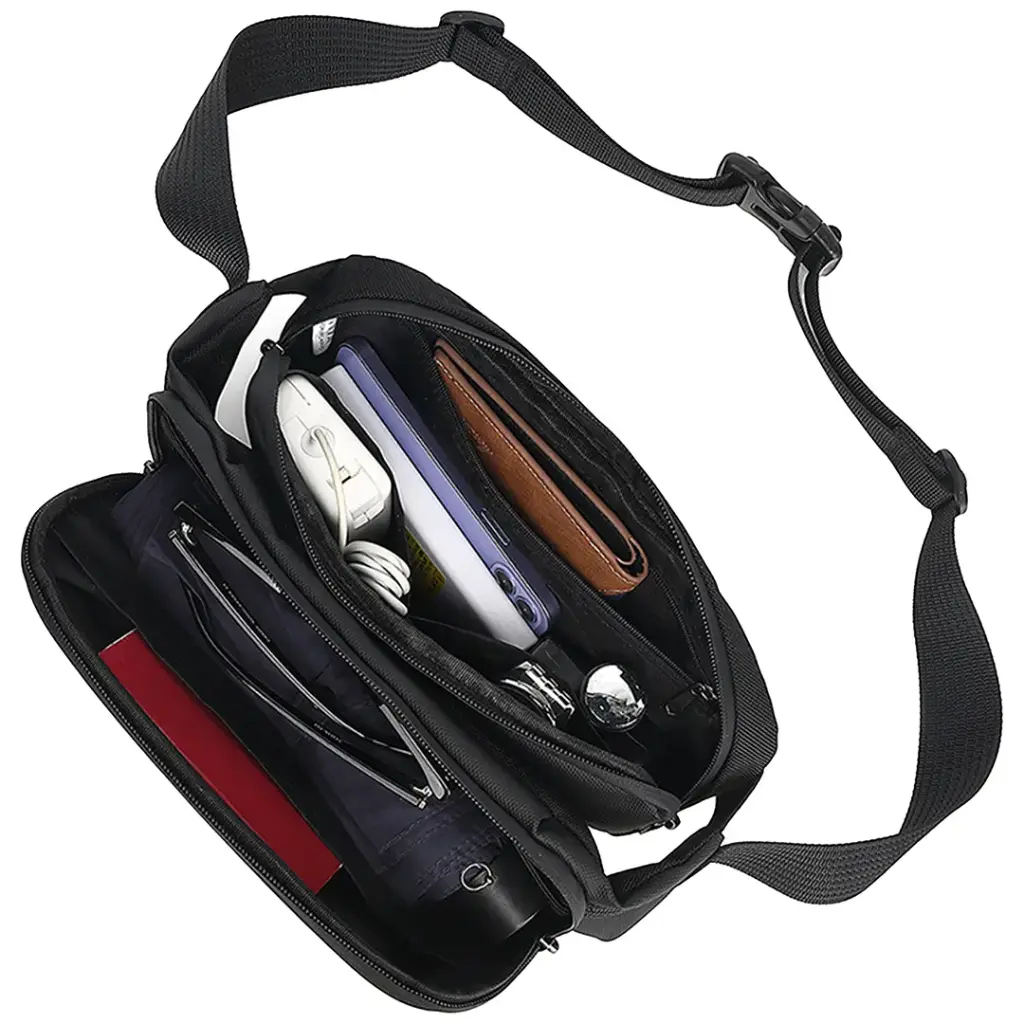 Black Green Lion Cleveland Crossbody Bag with various items inside on a white background