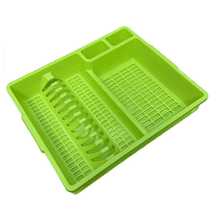 Green plastic tray with compartments on a white background