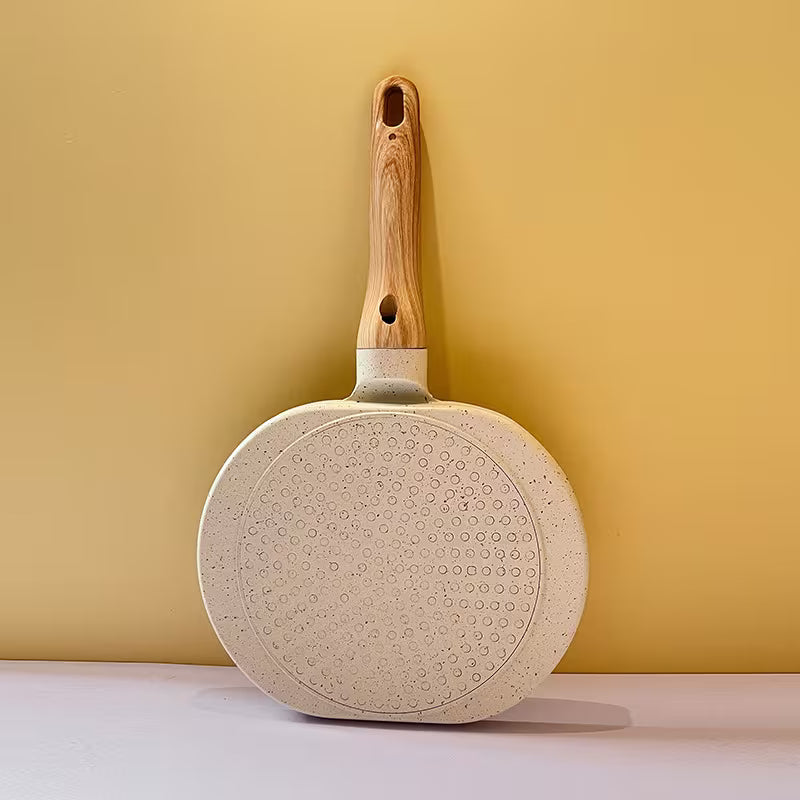 Multi-Functional Breakfast Frying Pan with wooden handle on a yellow background