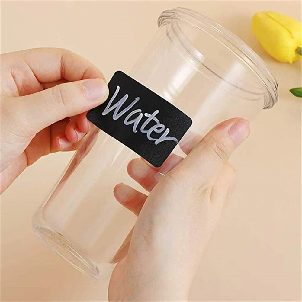 Someone is trying to paste Reusable Black Chalkboard Labels Roll on the bottle