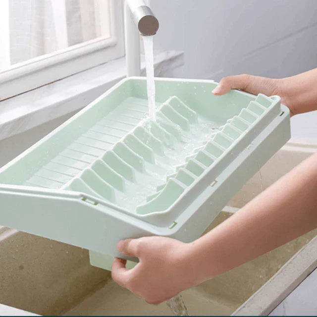 Someone cleaning the Dish Drain Tableware Storage Rack