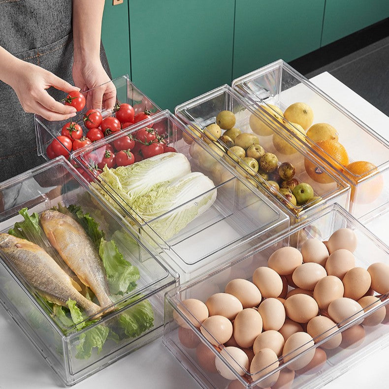 A transparent plastic drawer for fruits and vegetables, designed for refrigerator storage