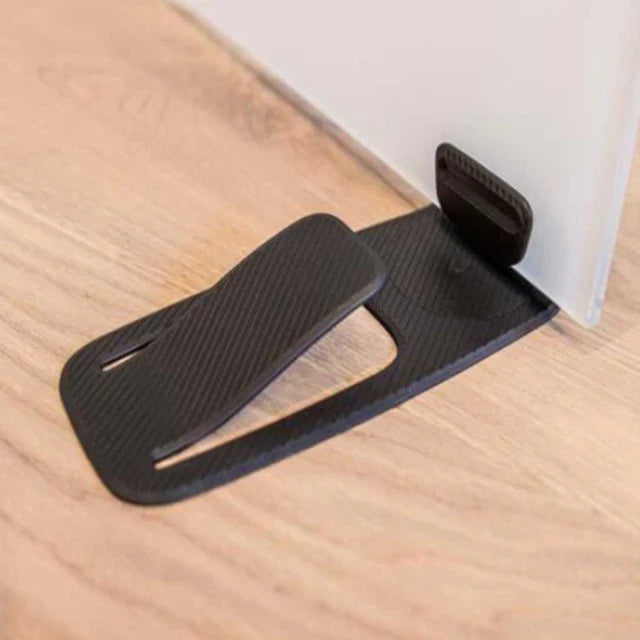 A glass door being held by an Innovative Door Stopper