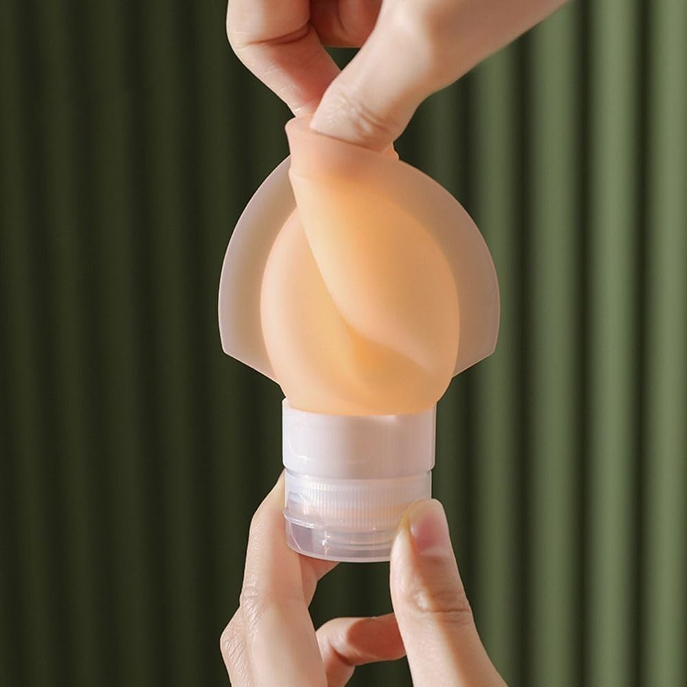 Person holding a  Silicone Travel Bottle against a green background