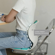 A Person is Sitting in a Posture Correction Chair Seat.