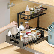 Sliding Storage Rack is placed on kitchen cabinet organized with spices.