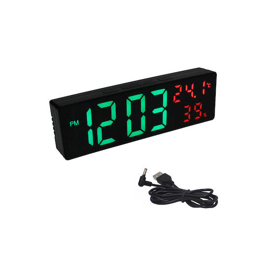 Digital clock with green and red display on a white background