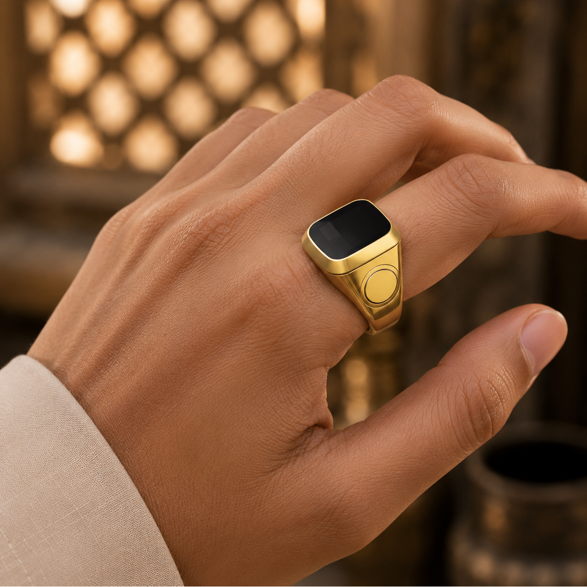 Hand wearing a Smart Tasbih Ring Counter with a blurred warm-toned background