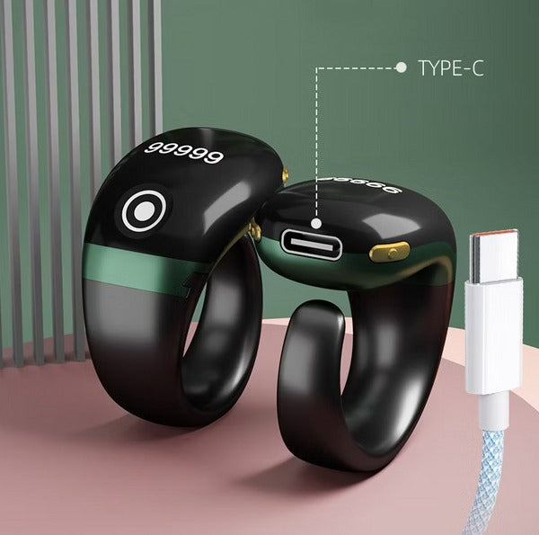 Smart Tasbih Ring with 'TYPE-C' connection on a pink surface with green background