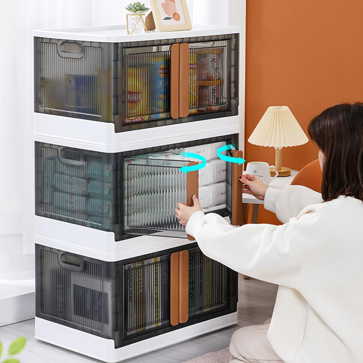 A Woman is Opening the Door Of Stackable Storage Bins.