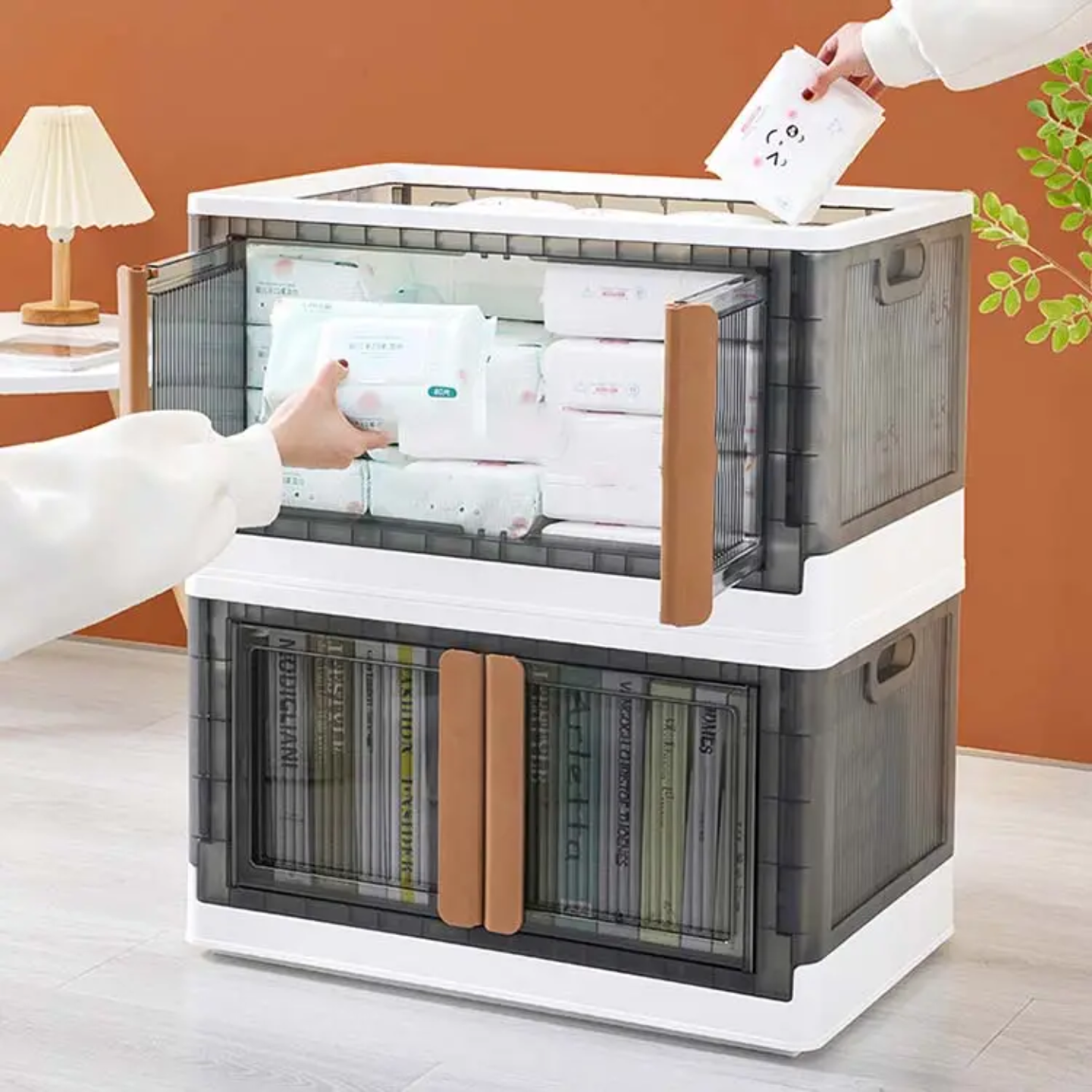 A Person is Keeping Some Essentials in to Stackable Storage Bins.