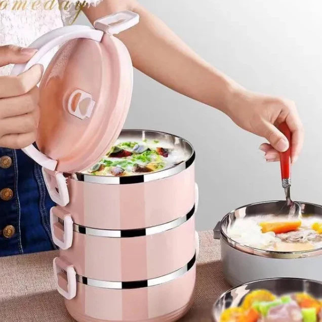 A Person is serving from Stainless Steel Lunch Box.