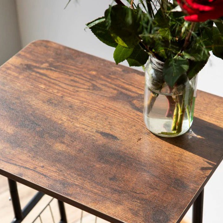 Vase with flowers on a Mobile Side Table with Storage Basket