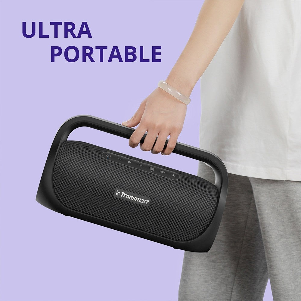 A Person is Holding Tronsmart Bang Mini Portable Party Speaker.