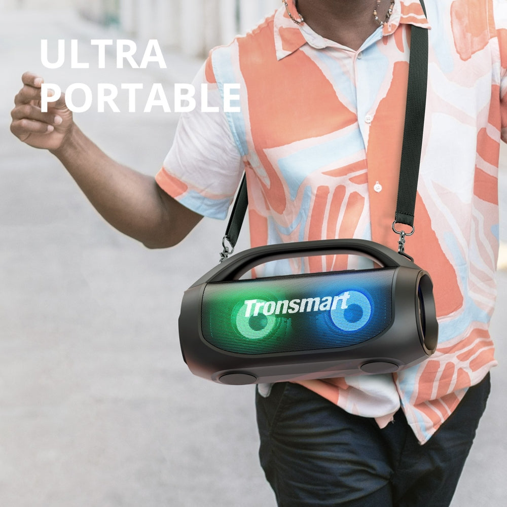 A Person is Carrying Tronsmart Bang SE Portable Party Speaker in his Shoulder.