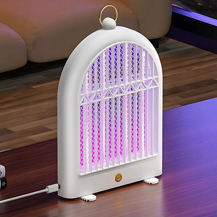 USB Rechargeable Electric Mosquito Killer Lamp with purple light on a wooden floor