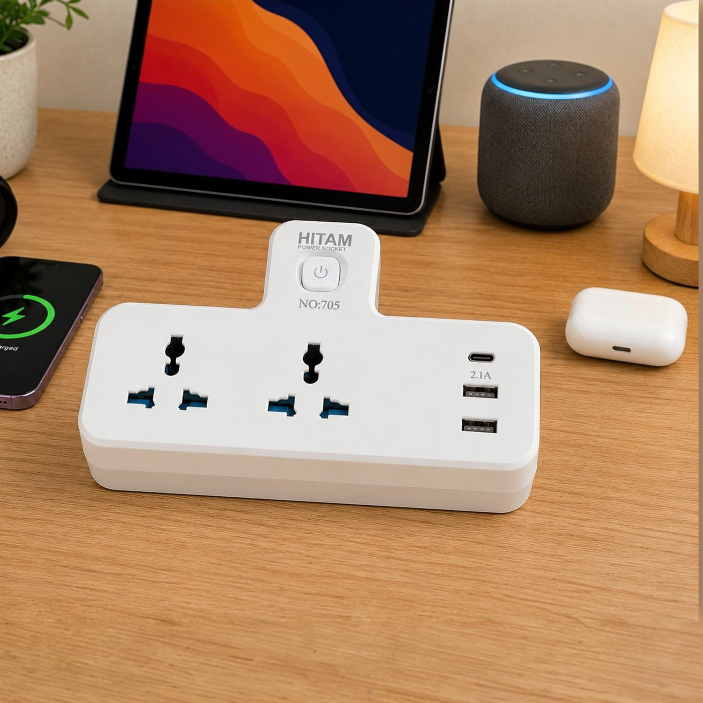 Universal Power Socket Adapter with multiple outlets and USB ports on a wooden desk with electronic devices.