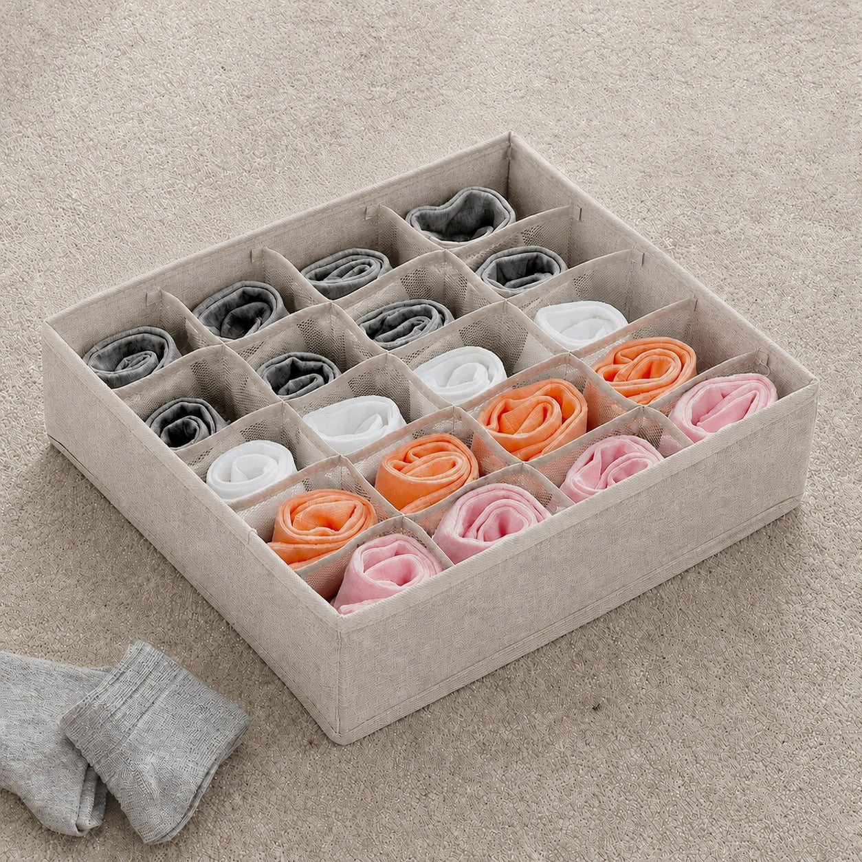 20 Grid Foldable Drawer Organizer Storage Box with neatly folded socks in various colors on a beige carpet.