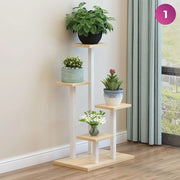 4-Layer Indoor Plant Stand with some plants placed next to a window in a room 