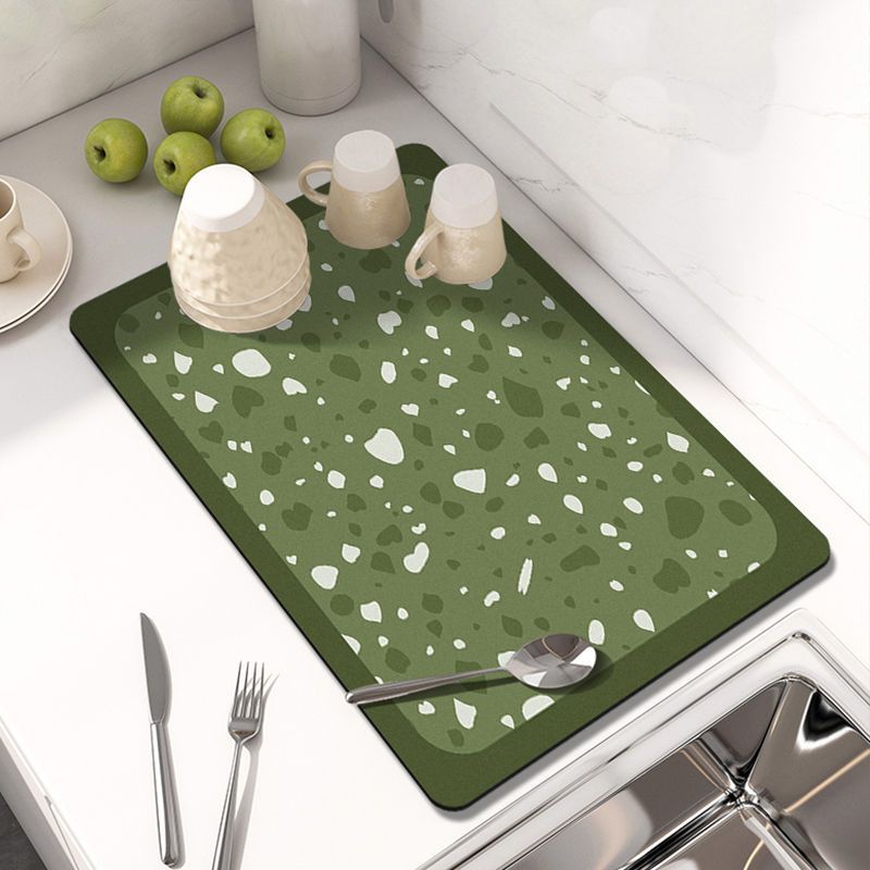 Showcasing Dish Drying Mat with spoon and mugs kept on a kitchen counter top