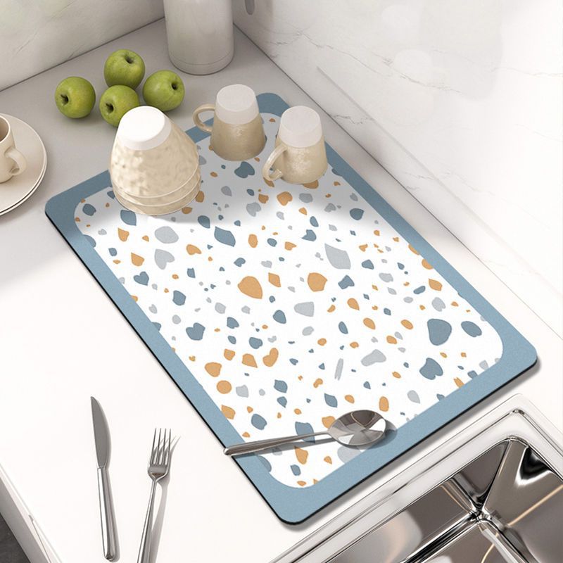 Showcasing Dish Drying Mat with spoon and mugs kept on a kitchen counter top