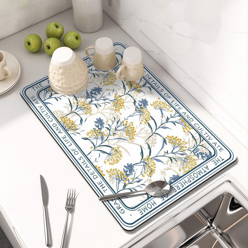 Showcasing Dish Drying Mat with spoon and mugs kept on a kitchen counter top