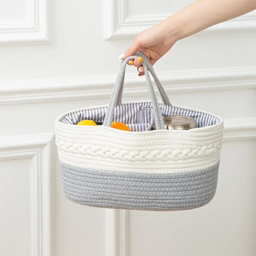 A person holding Grey color Nursery Storage Basket 