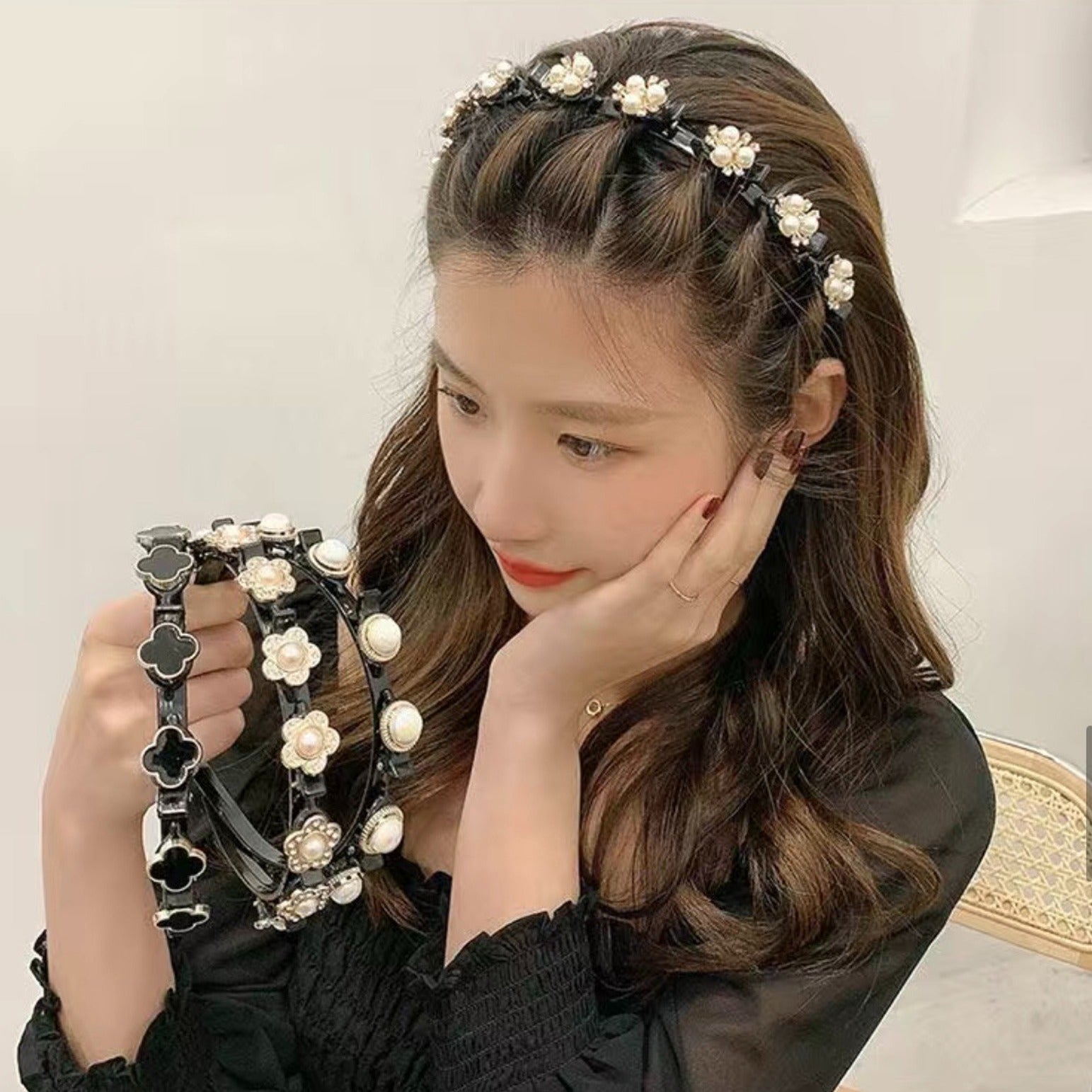 A lady worn Double Bangs Hairstyle Headband,also at the same time she holds 3 headbands in different designs