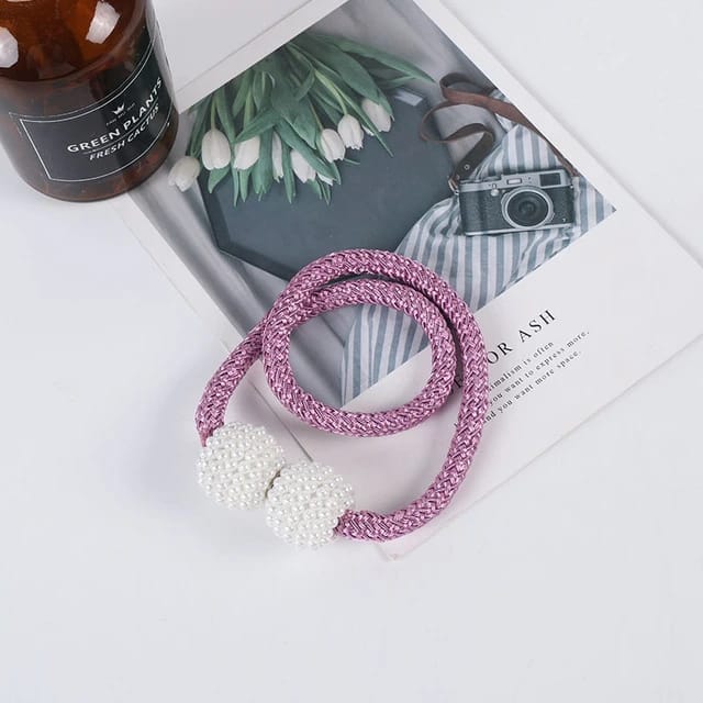 Showcasing Purple Color Magnetic Curtain Binding Rope placed on top of table
