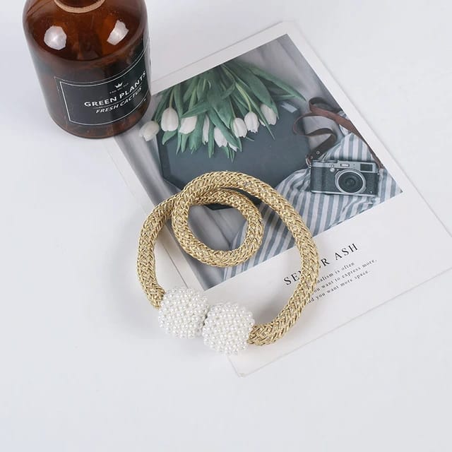 Showcasing Golden Yellow Color Magnetic Curtain Binding Rope placed on top of table
