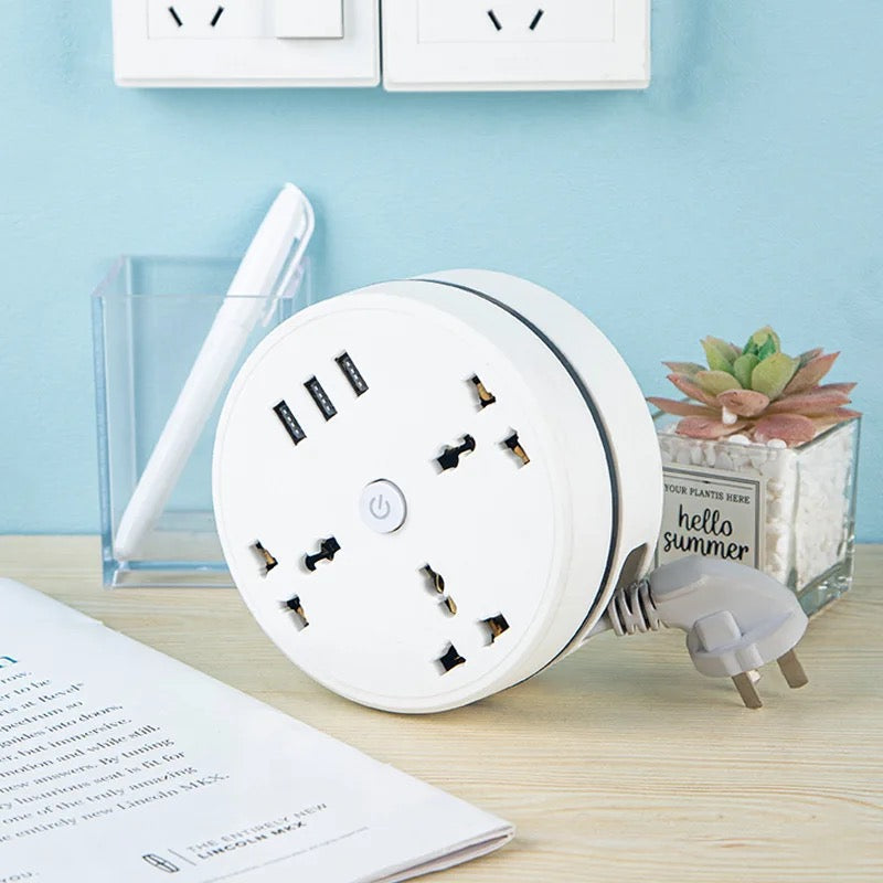 Round Universal Converter Power Strip Adapter - Extension Socket 3 Outlets with 3 USB Ports placed on desk