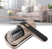 Wireless Dust Mite Removal Vacuum Cleaner with a metallic champagne-gold body, black handle, and clear dust container, shown in front of a blurred living room background with a sofa and coffee table.