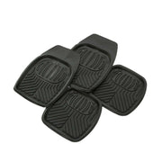 Four black car floor mats with textured design on a white background