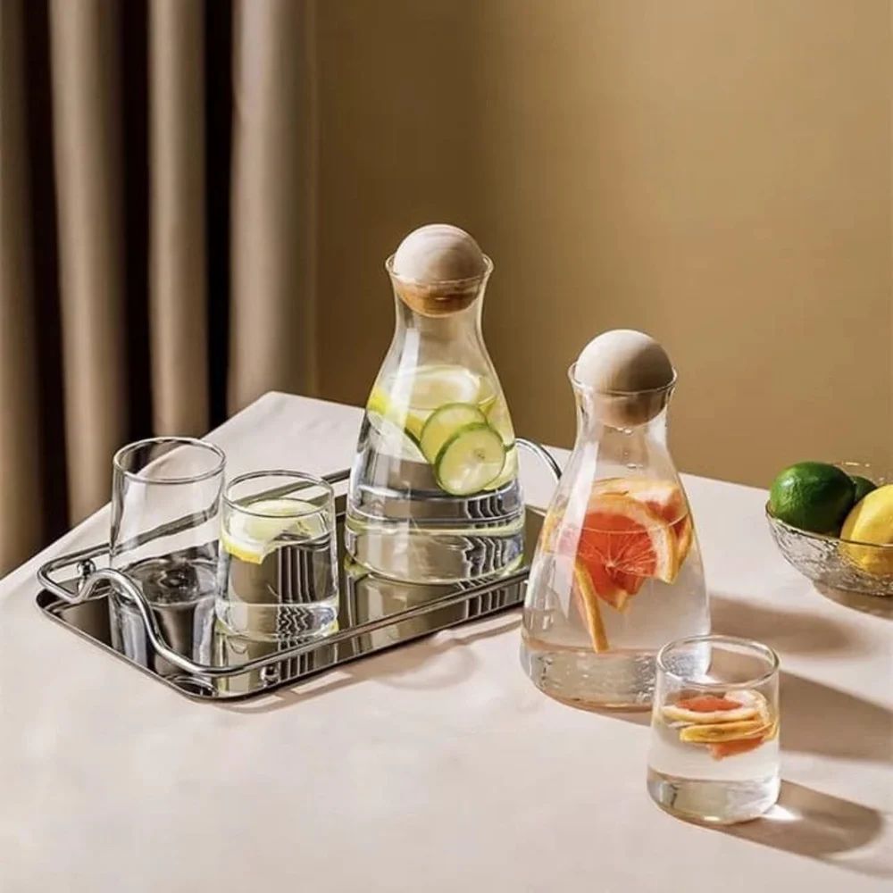 two sets of glass set that has beautiful jug with cork
