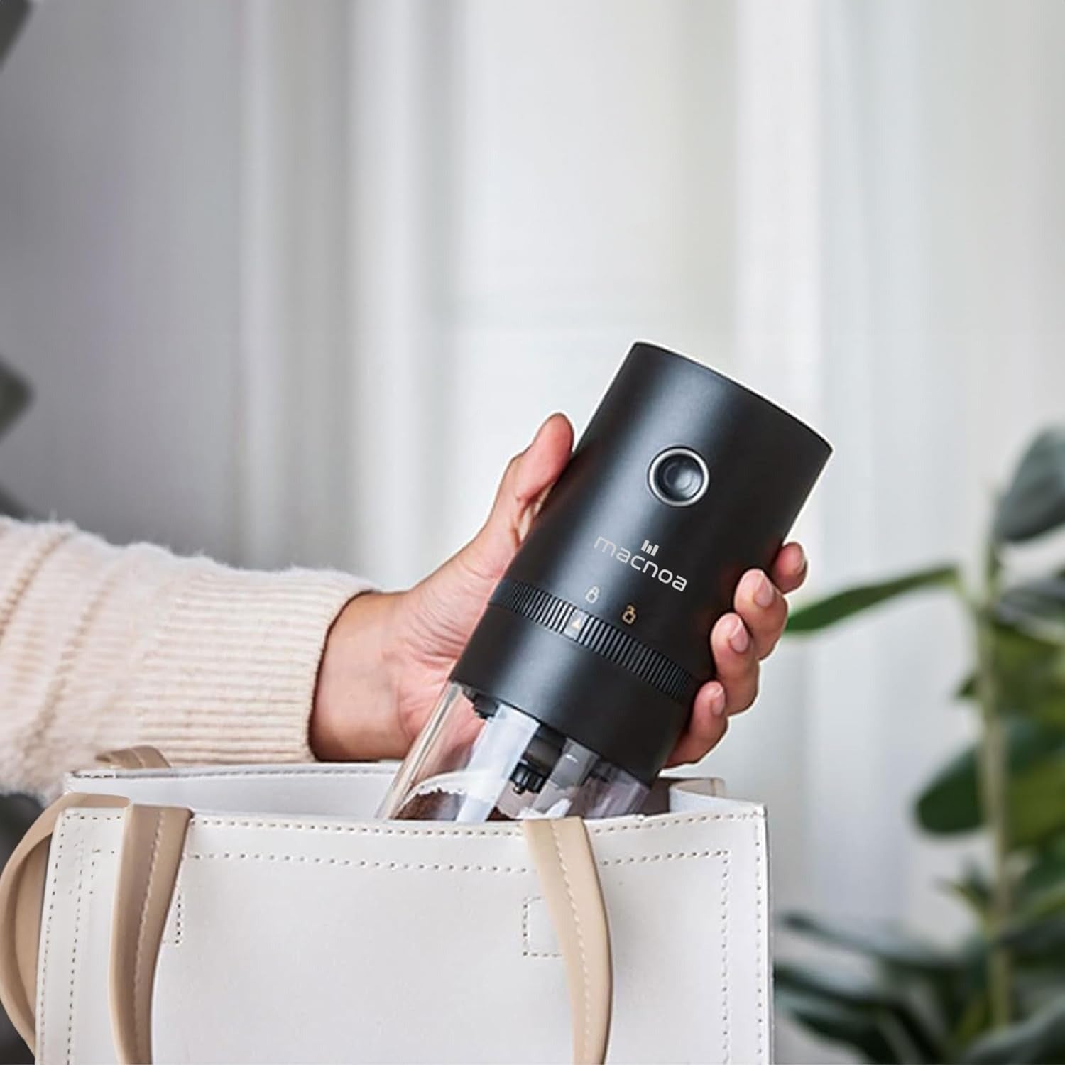 lady keeping Macnoa Coffee Grinder in her bag