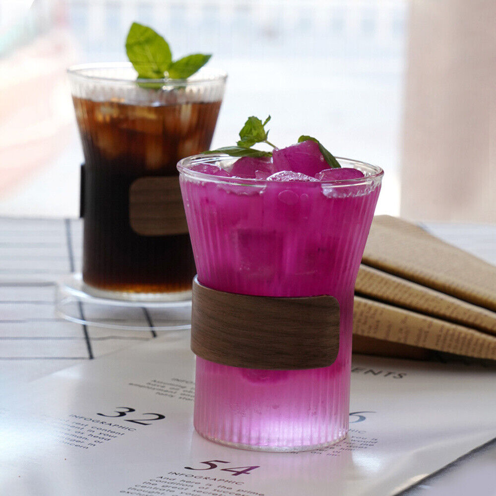 Wide Mouth Glass Coffee Mug with liquid, ice, and mint leaves