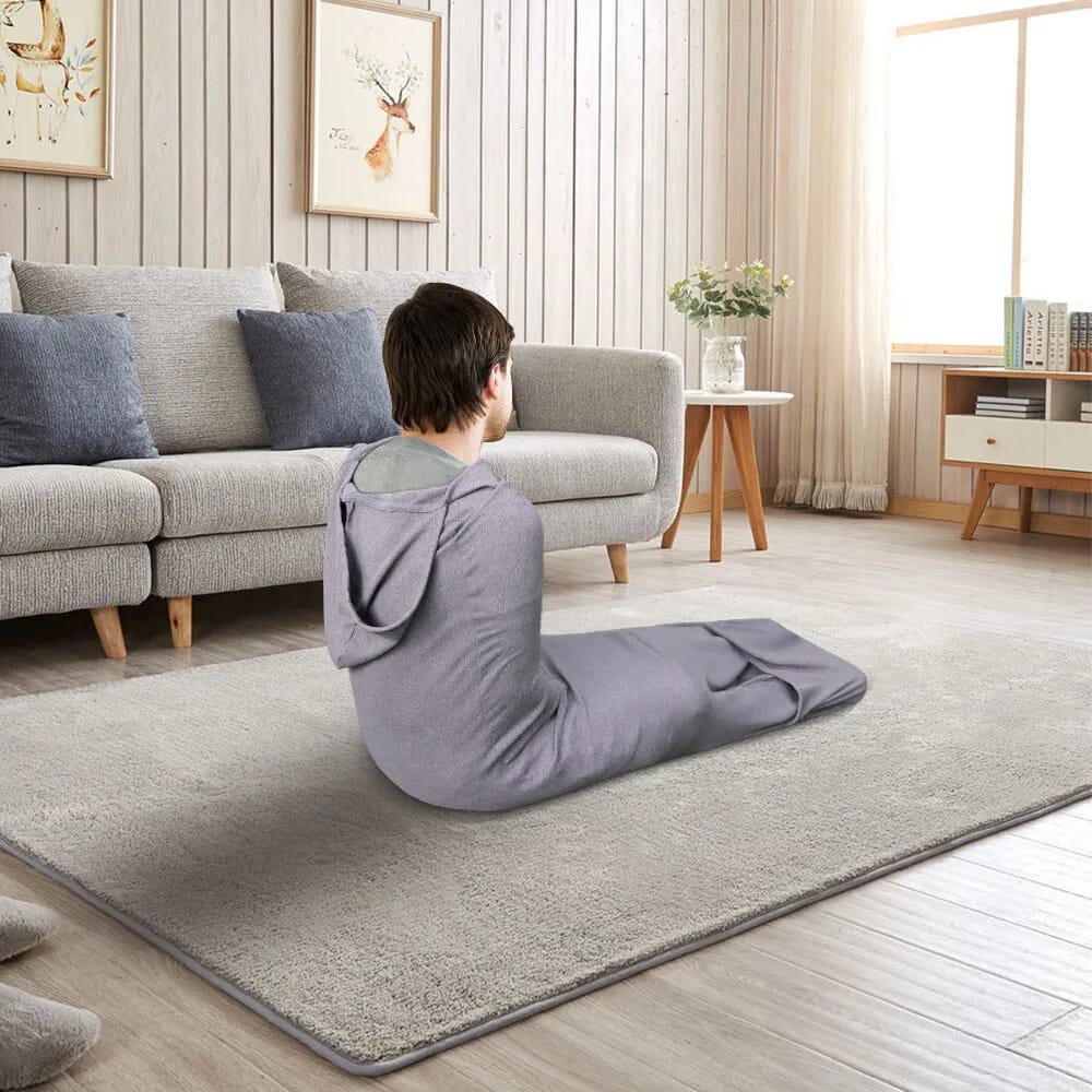 A Man in a Wearable Sleep Pod.
