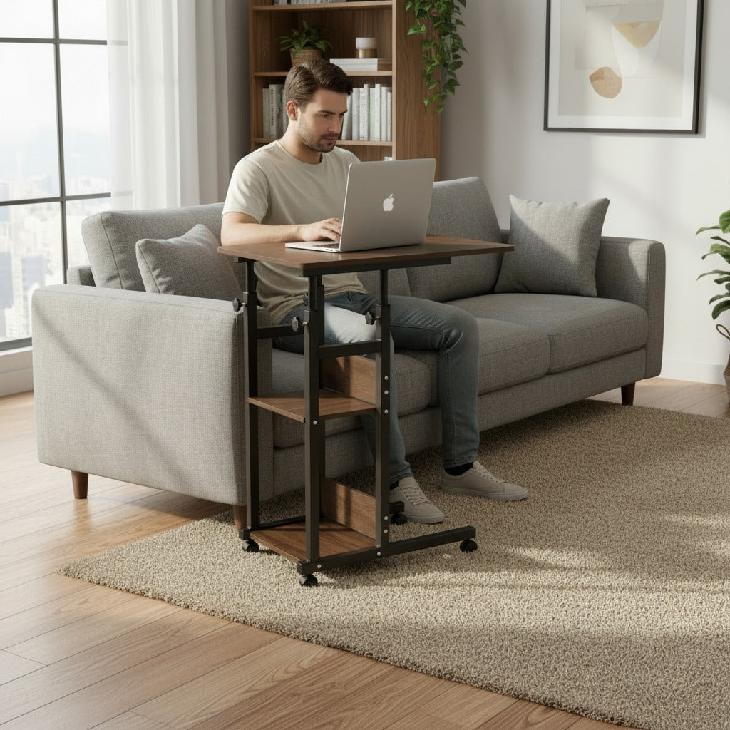 Person using a laptop on a Adjustable Overbed Laptop Table in a living room.
