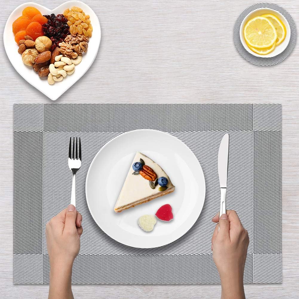 Dining Table Placemats with a slice of cake, fork, and knife on a textured surface.