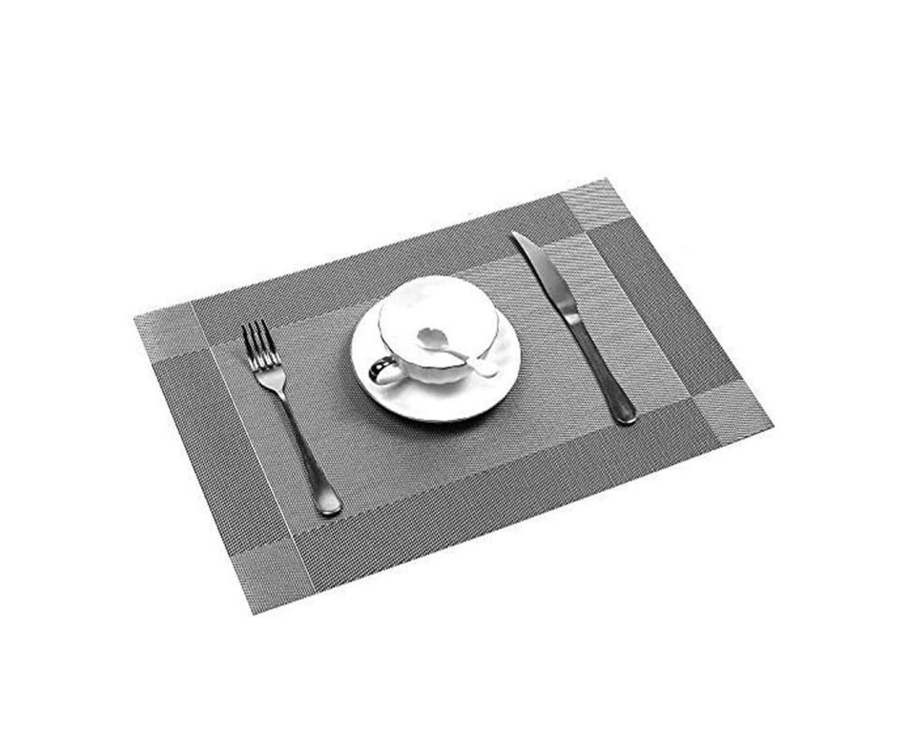 Dining Table Placemats with a white plate, cup, and silverware on a white background